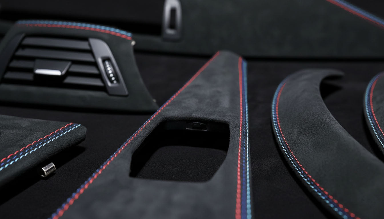 Macro shot of BMW 3 & 4 Series Alcantara Interior Trim – Tricolor Stitching (F30, F31, F34, F36, F80 left hand drive)