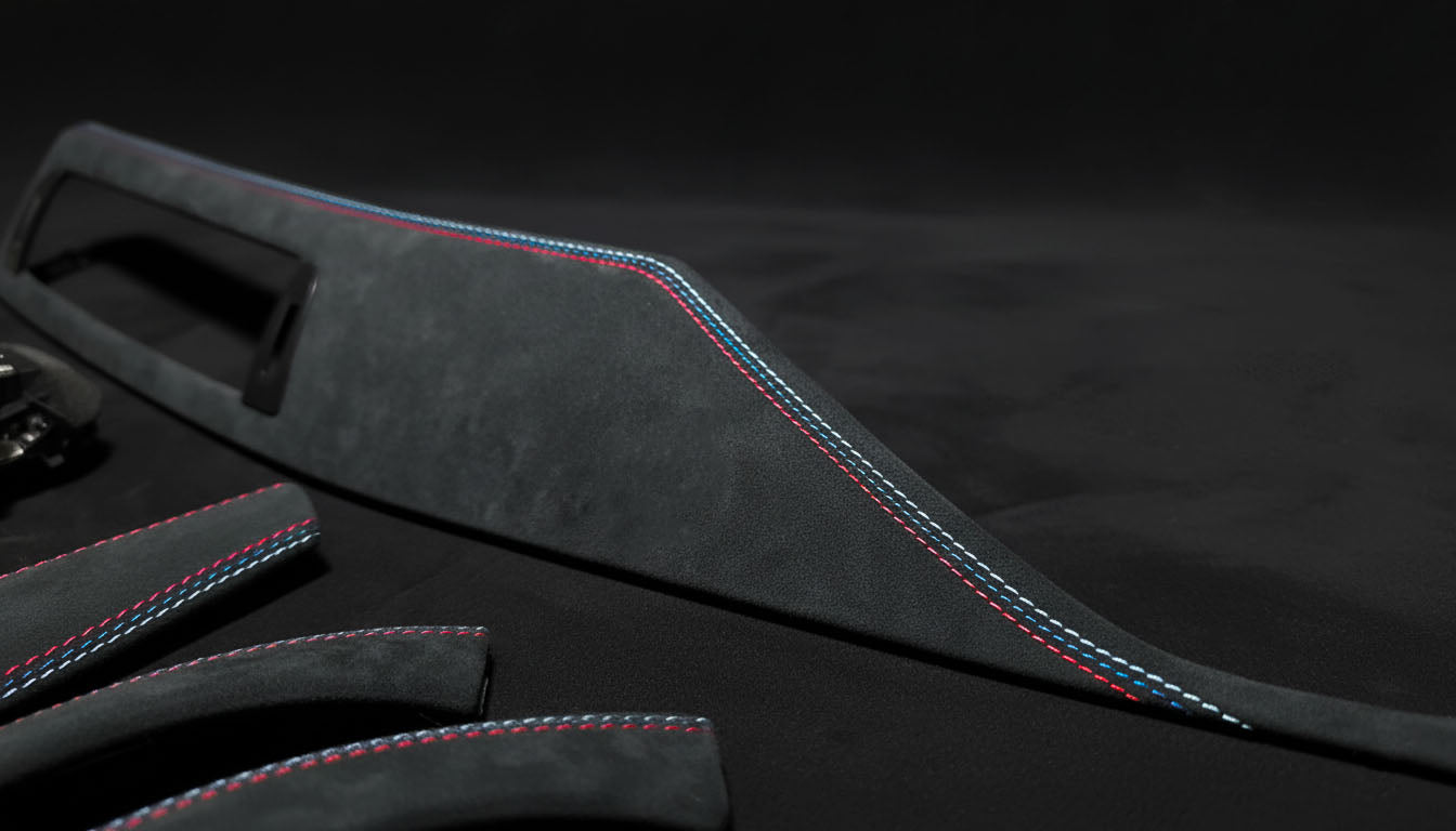 Macro shot of BMW 3 & 4 Series Alcantara Interior Trim – Tricolor Stitching (F30, F31, F34, F36, F80 left hand drive)